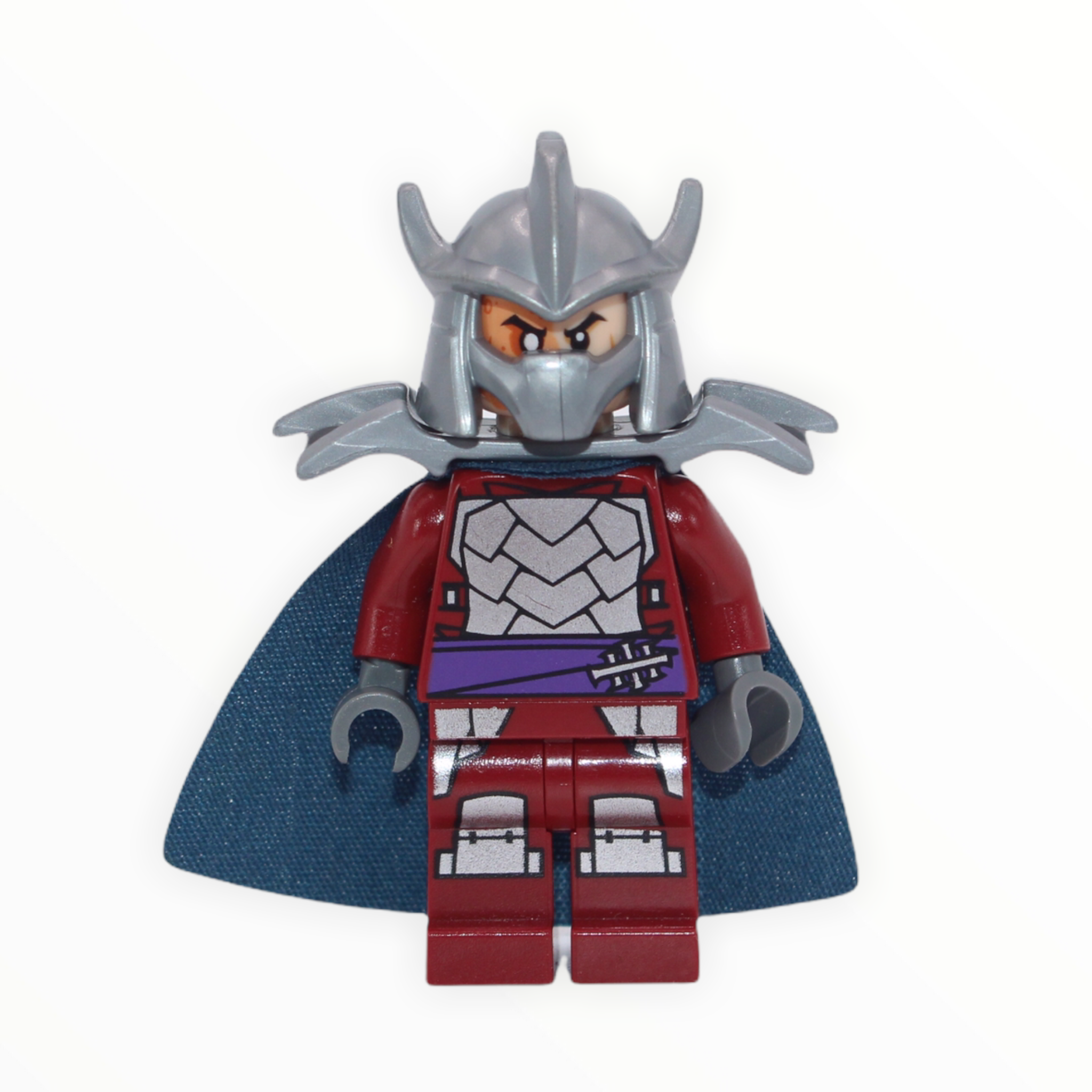 Shredder (dark red outfit, dark blue cape, shoulder armor)